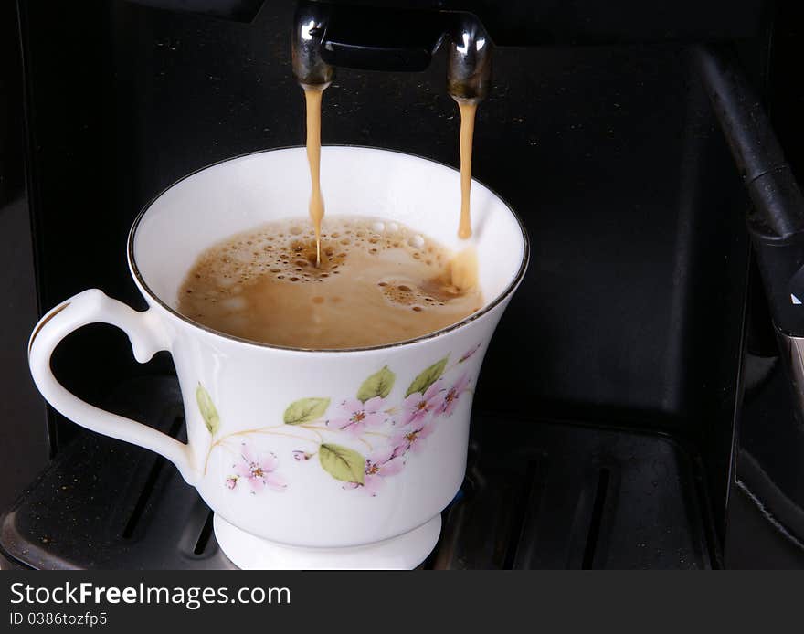 Espresso pouring into a cup