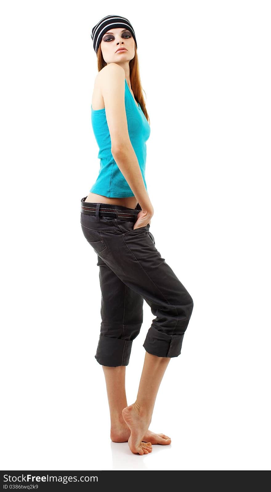 Girl in a dark makeup in blue T-shirt on white background