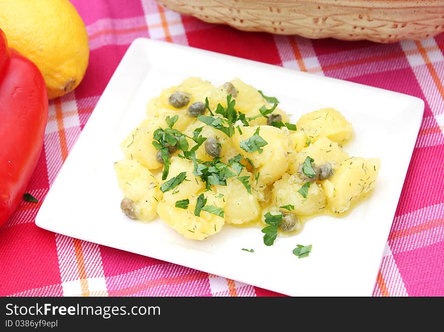 Fresh salad of potatoes on a plate