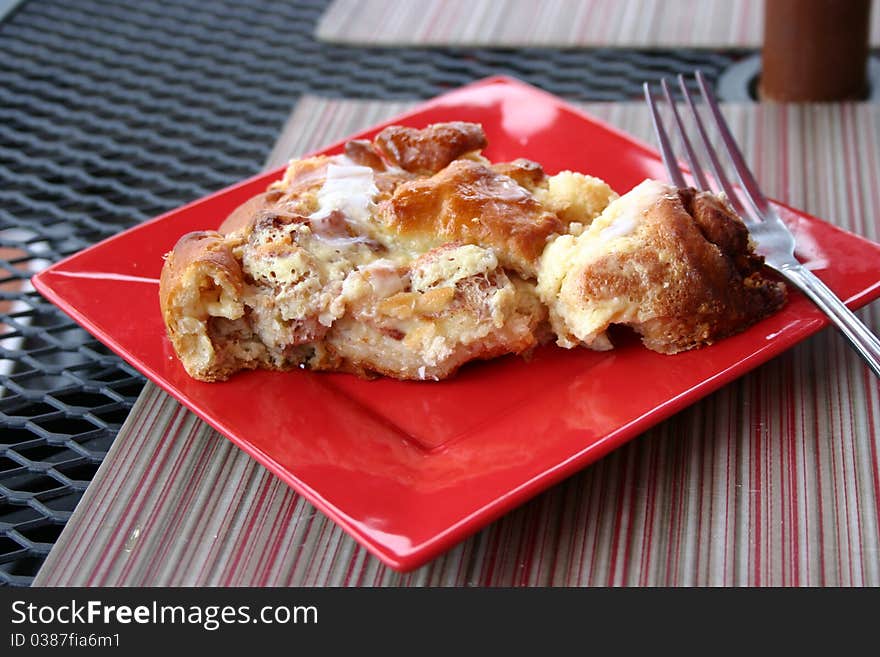 Fresh backed cinnamon desert on red plate