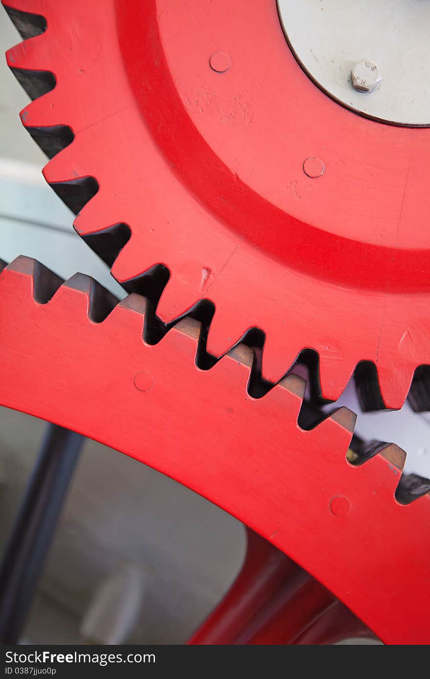 Closeup view of huge cogwheels of the train engine