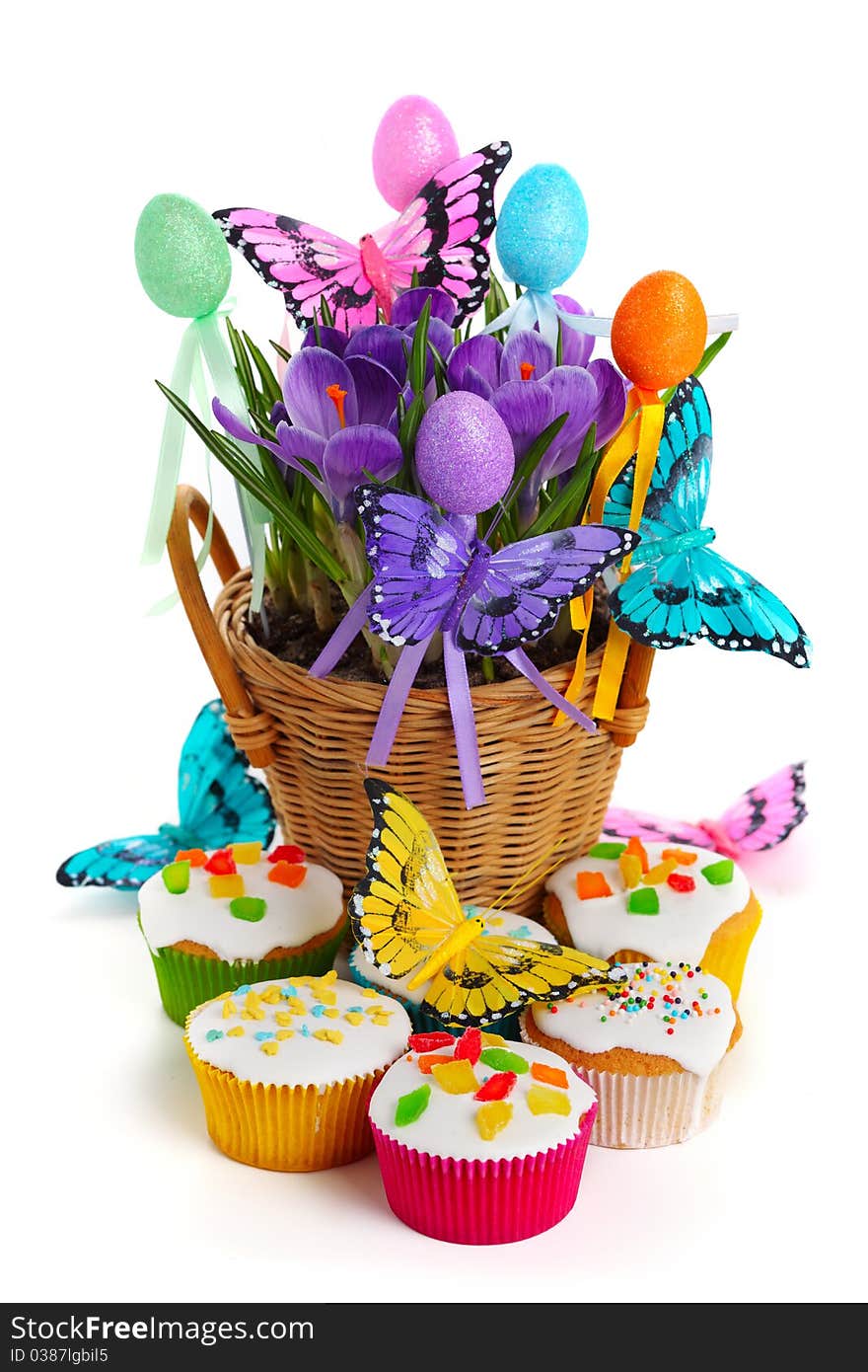 Easter arrangement with crocuses, cupcakes, butterflies and eggs