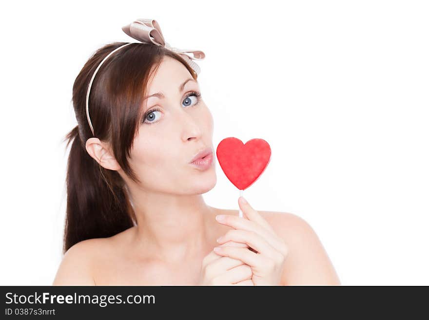 Female portrait with heart candy. Female portrait with heart candy