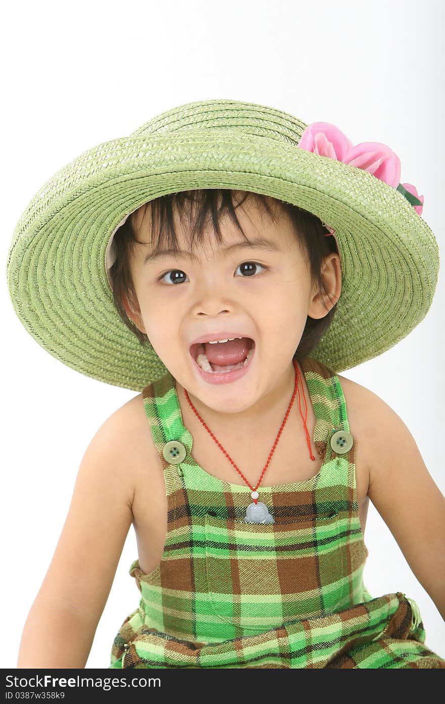 A laughing girl with a green hat.