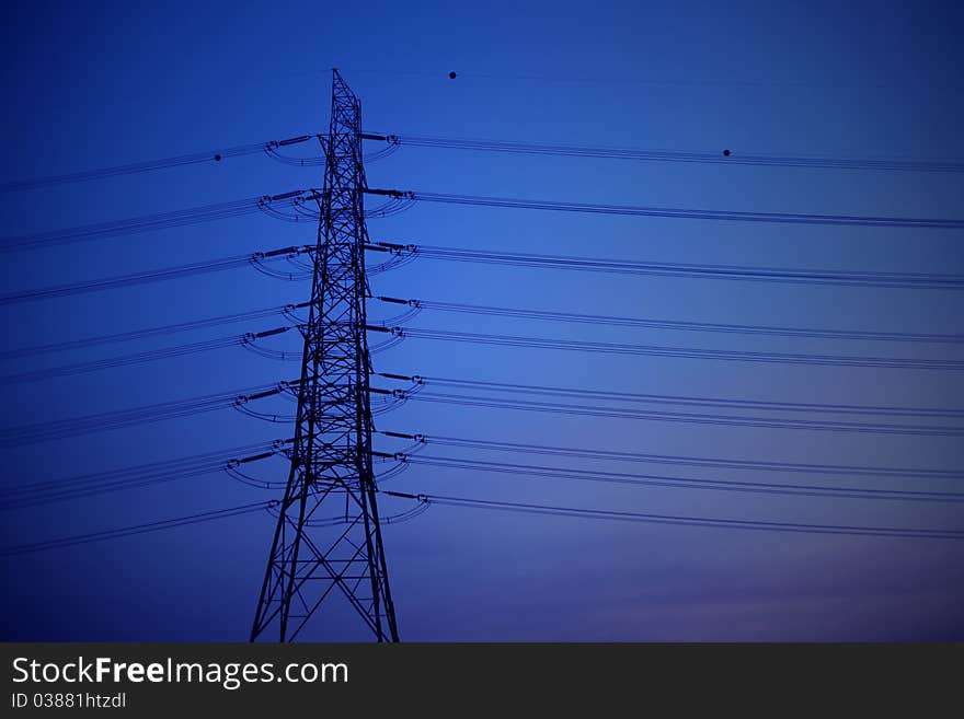 High voltage post with blue sky