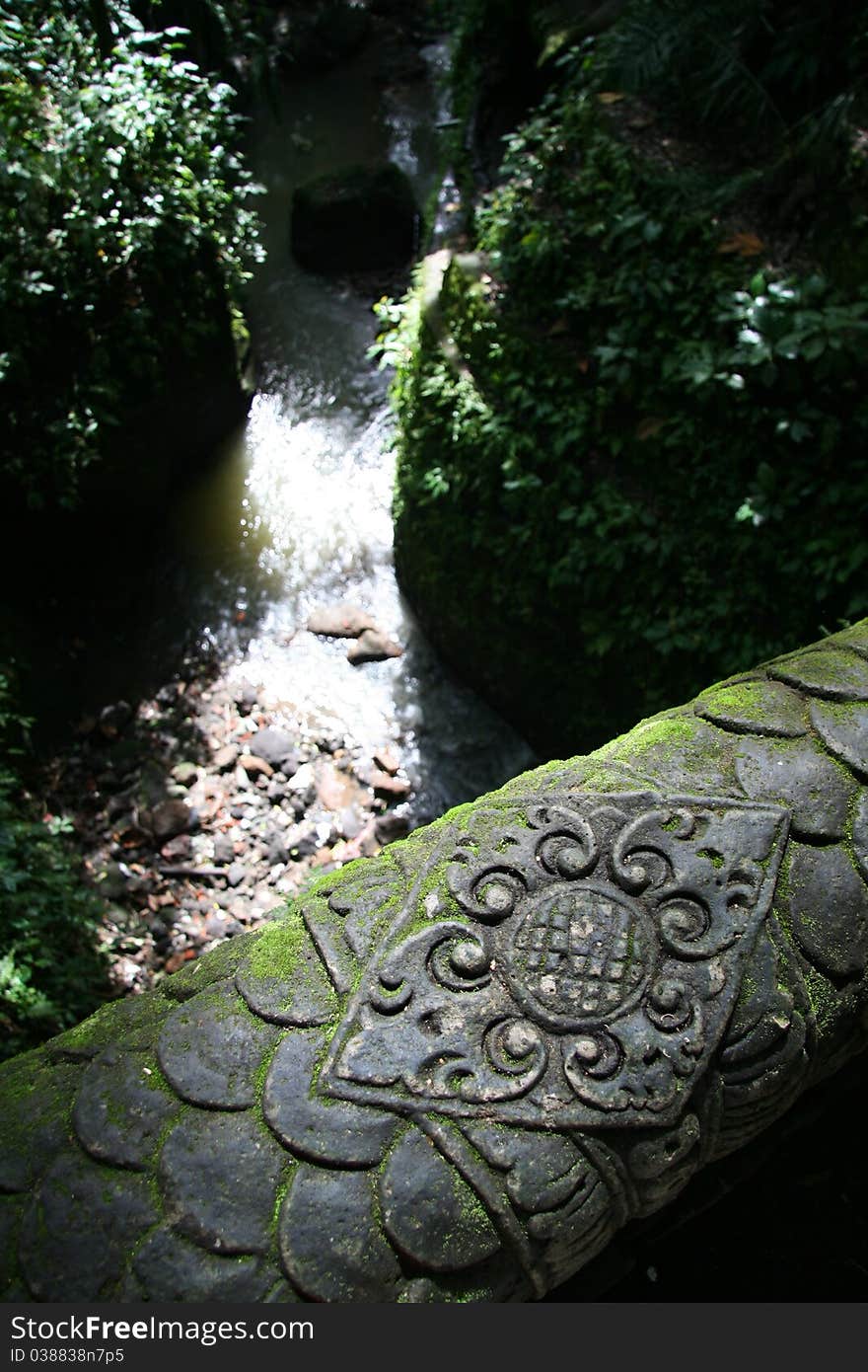 Image of an old stone bridge and the Asian river