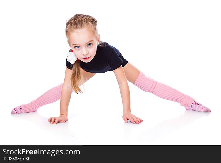 A beautiful girl is sitting on a split. isolated on a white background