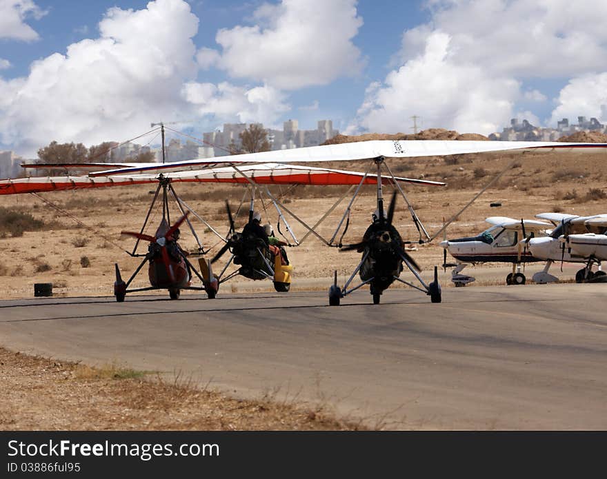 Small ultra light airplane in desert airport