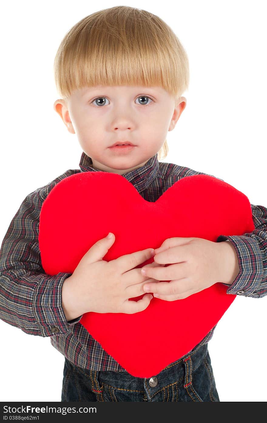 Little beautiful boy holds heart isolated on white