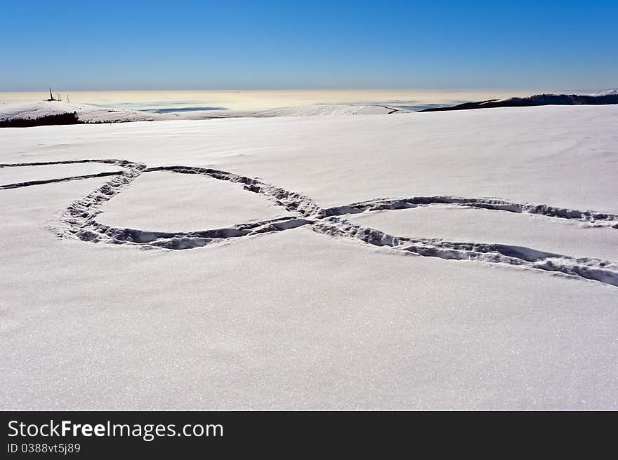 Footprints in the snow on a mountain ridge