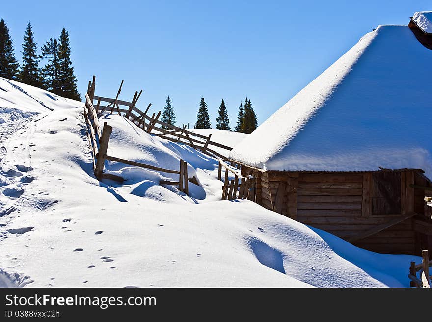 Refuge for shepherds in winter mountain scenery