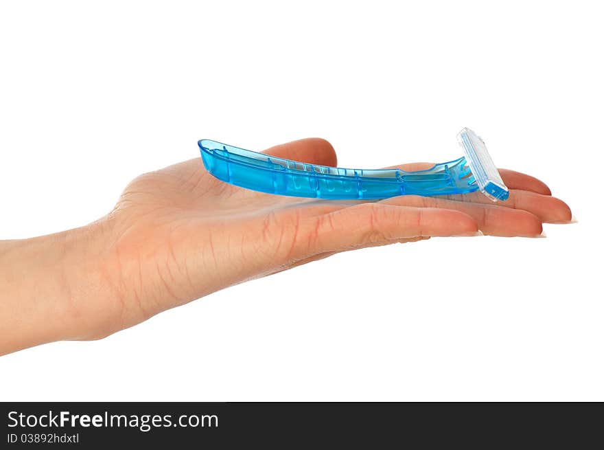 Woman holding a razor from a blue plastic for shaving legs