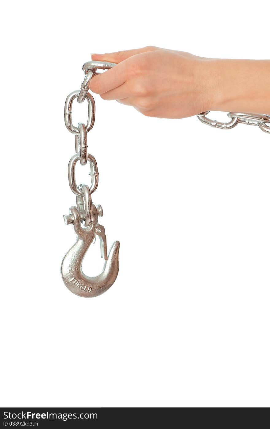 Chain with a hook in the hands of crane operator at construction site