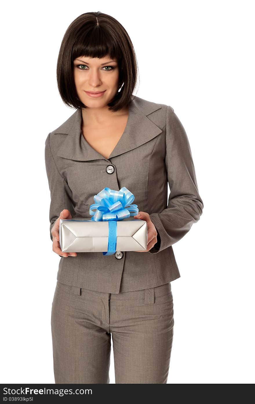 Woman holding a grey box with blue bow as a present. Woman holding a grey box with blue bow as a present