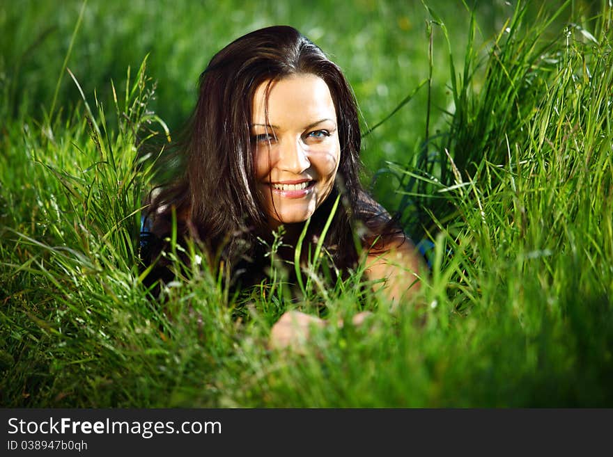 Brunette on grass