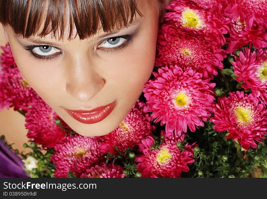 Portrait of a young woman with pink flowers. Portrait of a young woman with pink flowers