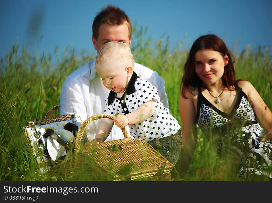 Picnic of happy family on green grass. Picnic of happy family on green grass