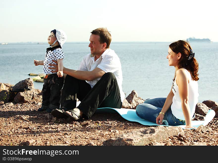 Picnic of happy family near sea. Picnic of happy family near sea