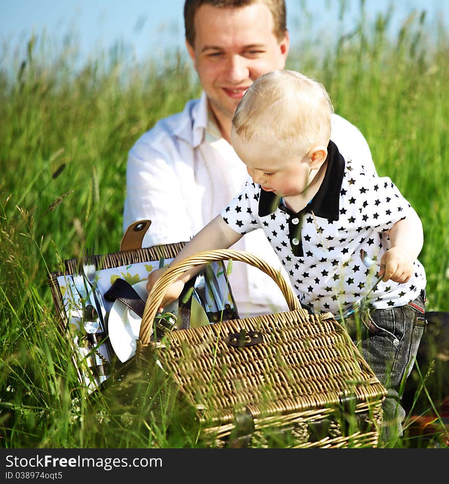 Father and son in the grass