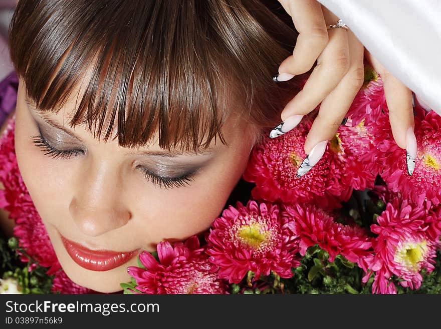 Portrait of a young woman with pink flowers. Portrait of a young woman with pink flowers