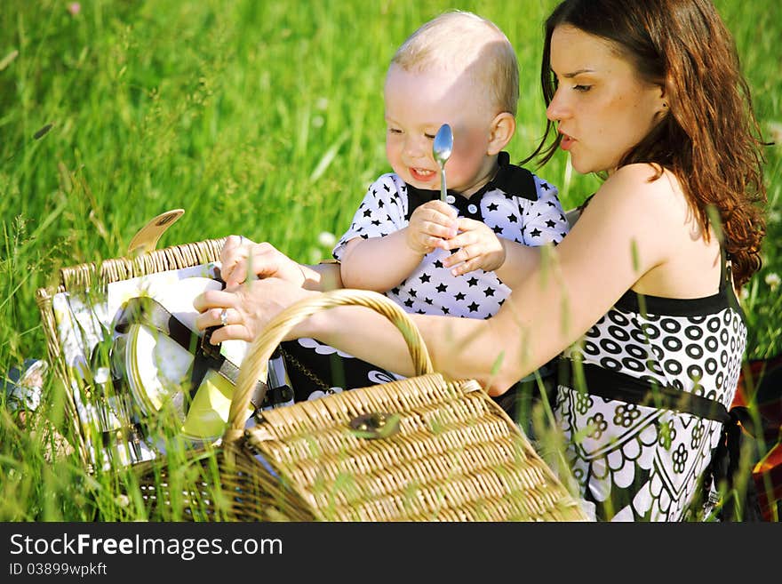 Picnic of happy family on green grass. Picnic of happy family on green grass