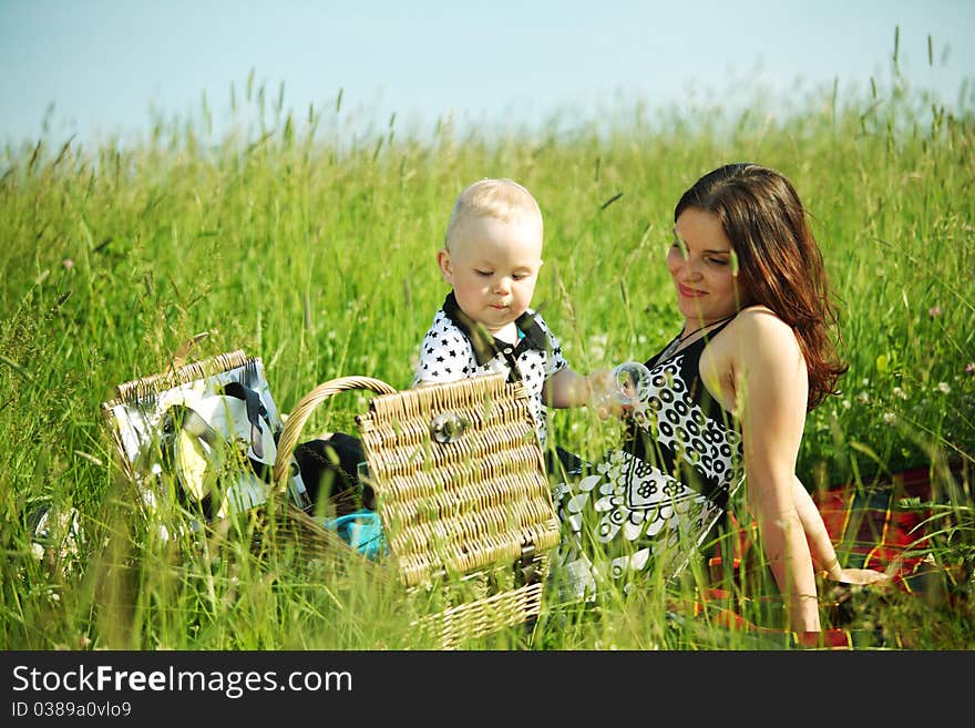 Picnic of happy family on green grass. Picnic of happy family on green grass