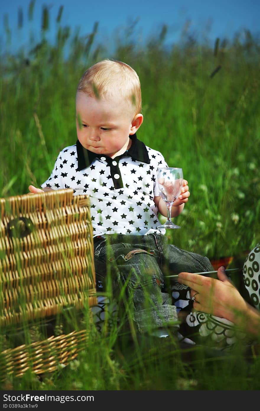 Picnic of happy family on green grass. Picnic of happy family on green grass