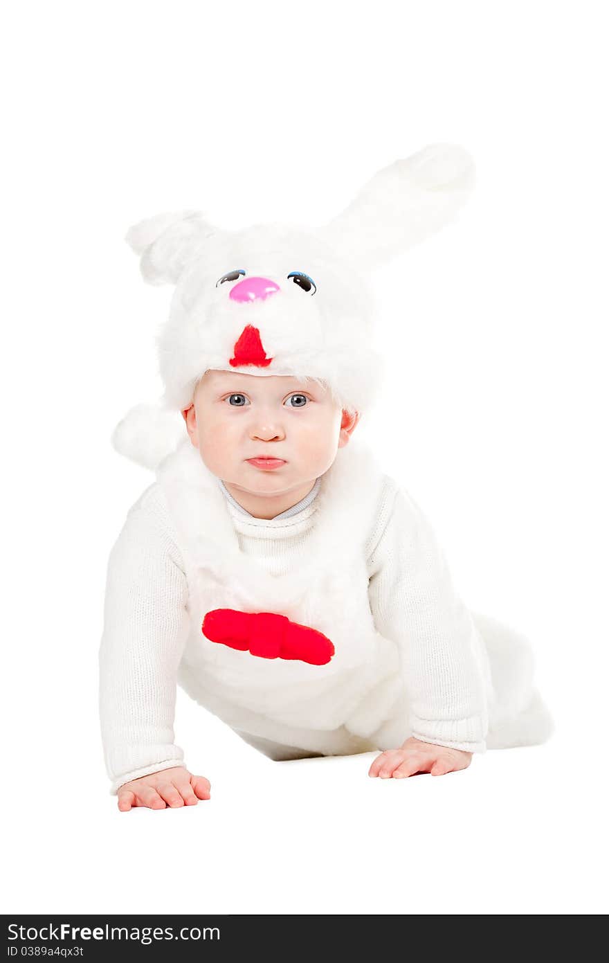 Little beautiful boy in rabbit costume with carrot isolated