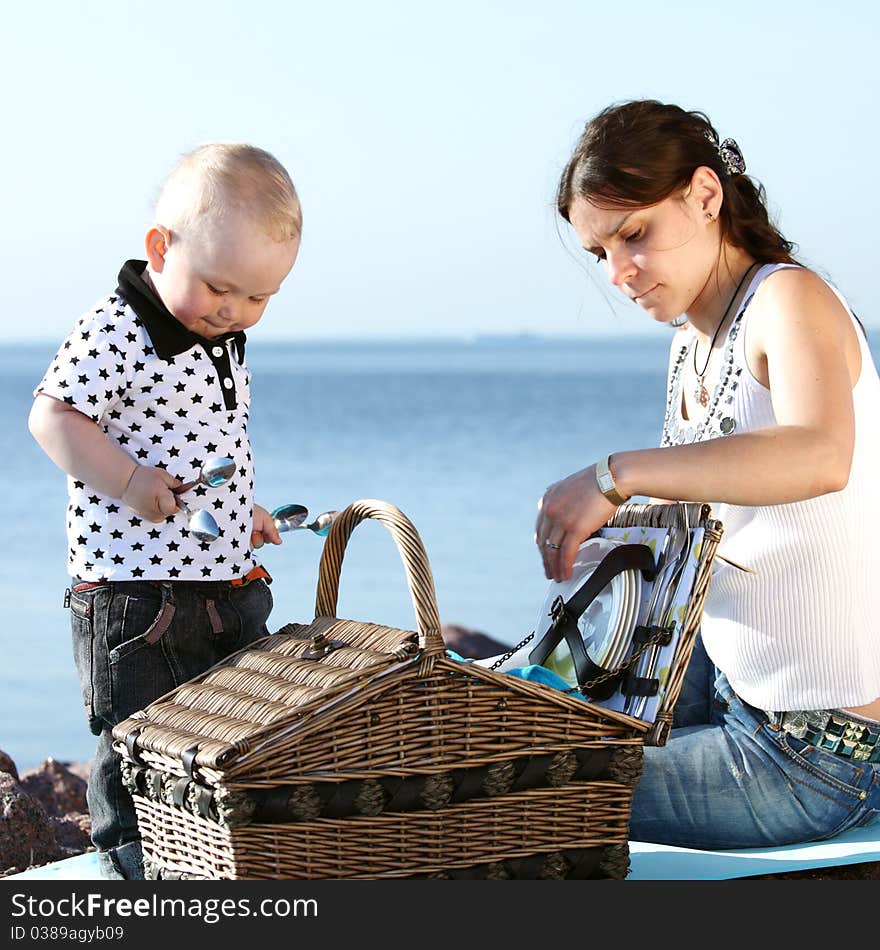 Picnic of happy family near sea. Picnic of happy family near sea