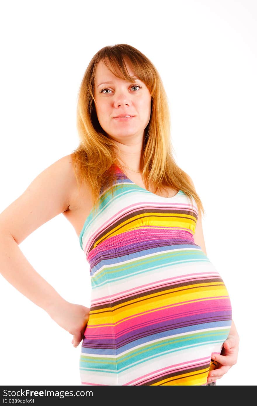 Beautiful pregnant woman staying on white background