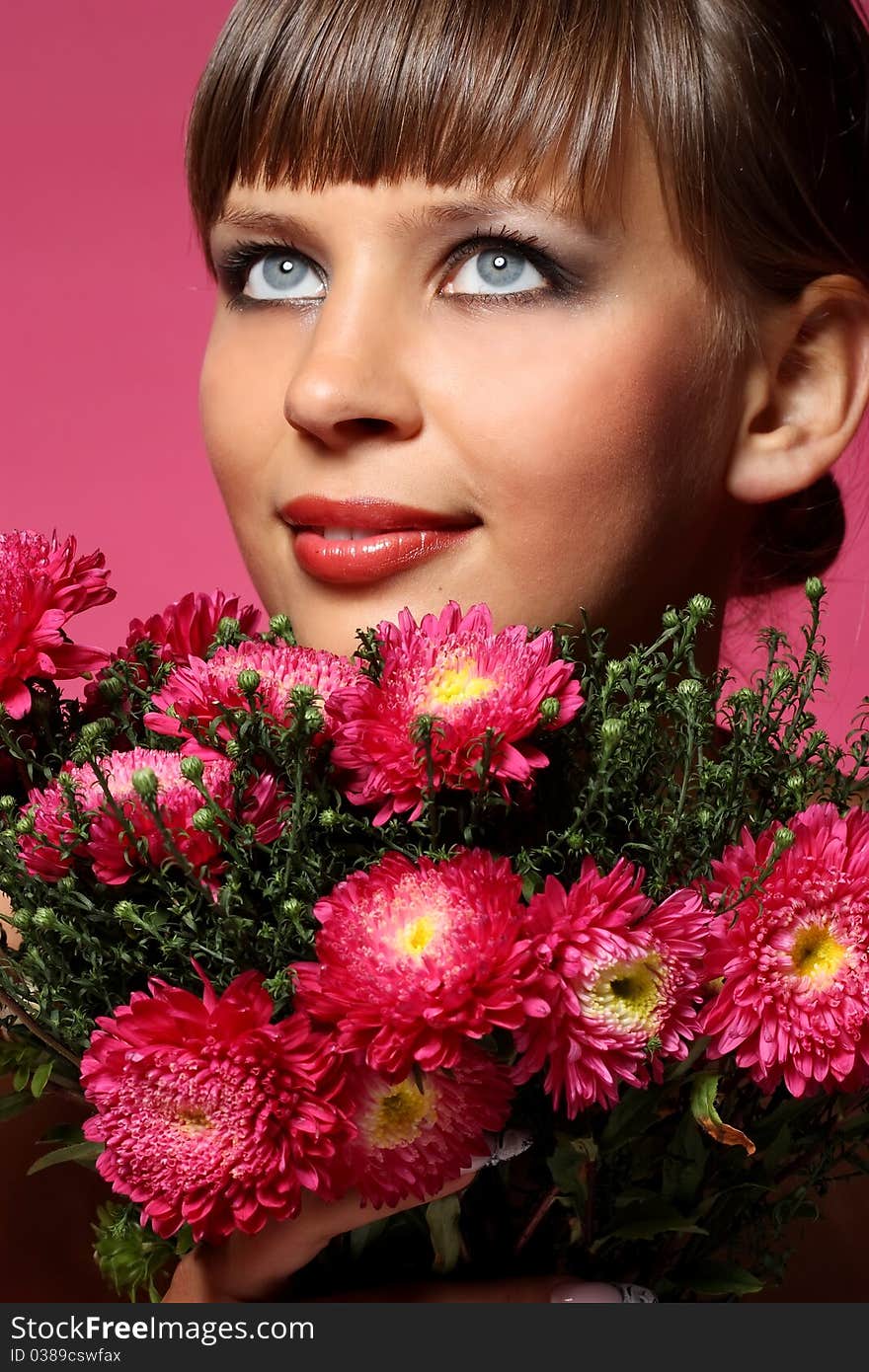 Portrait of a young woman with pink flowers. Portrait of a young woman with pink flowers