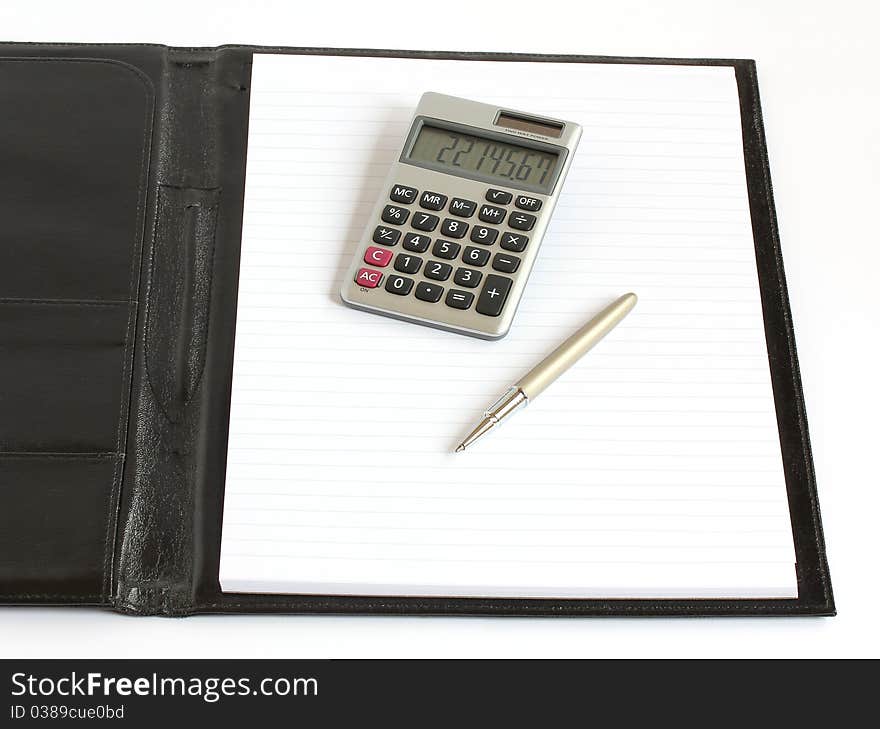 Leather folder with notebook pen and calculator isolated on white background