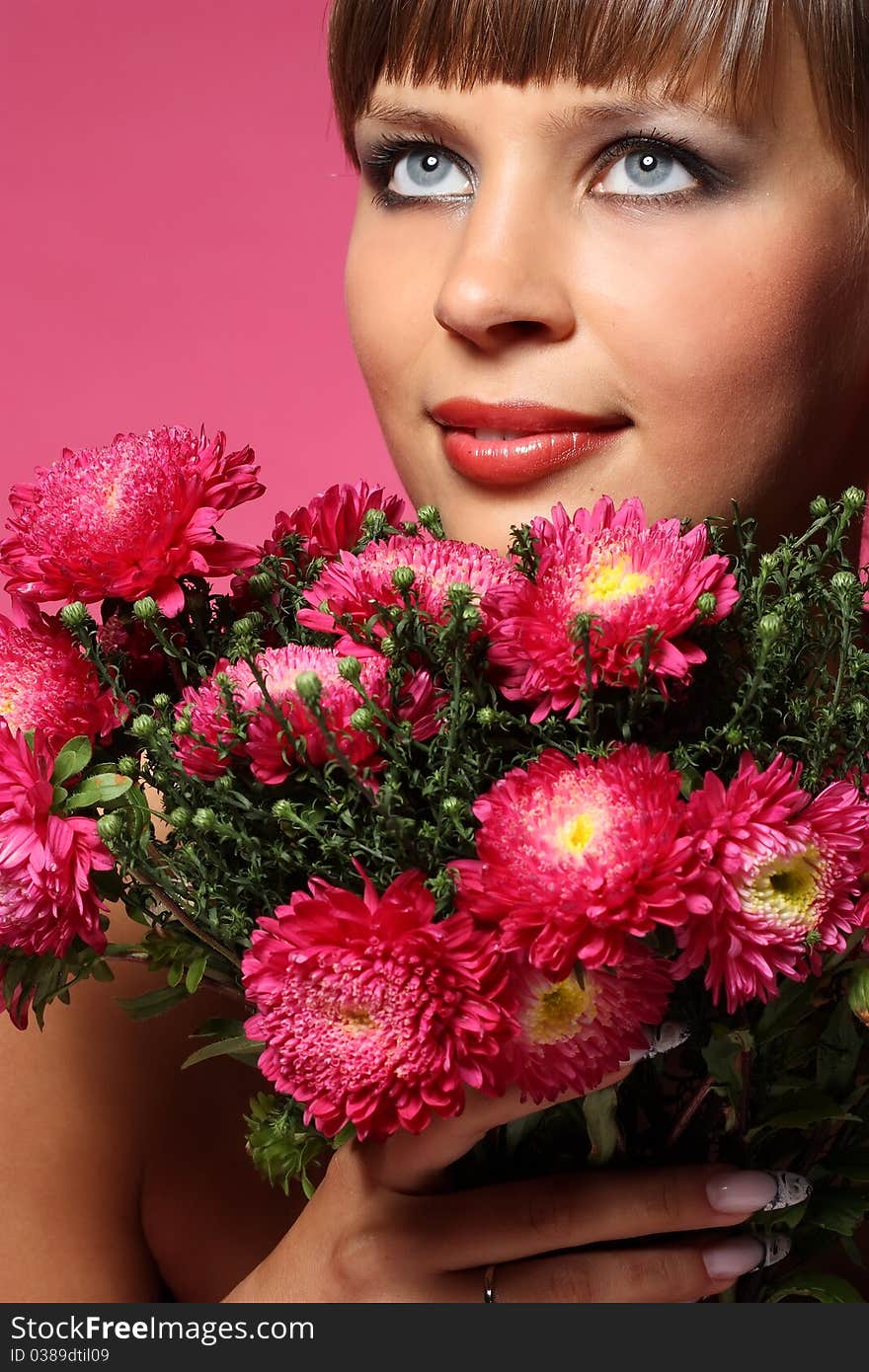 Portrait of a young woman with pink flowers. Portrait of a young woman with pink flowers