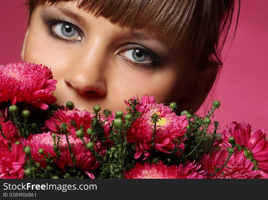 Portrait of a young woman with pink flowers. Portrait of a young woman with pink flowers