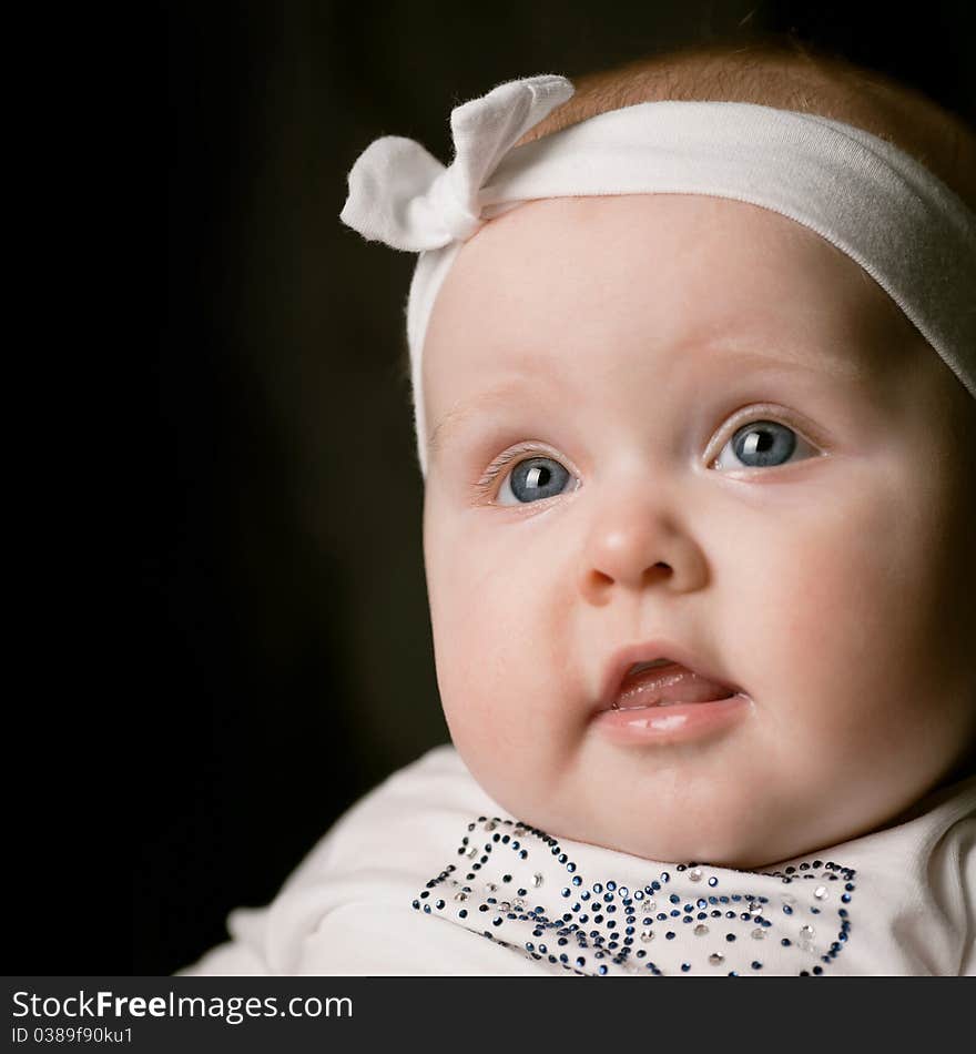 Little beautiful baby with white bandage portrait. Little beautiful baby with white bandage portrait