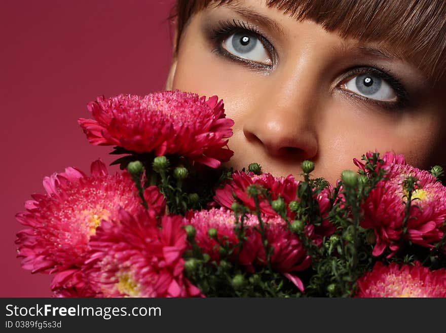 Portrait of a young woman with pink flowers. Portrait of a young woman with pink flowers