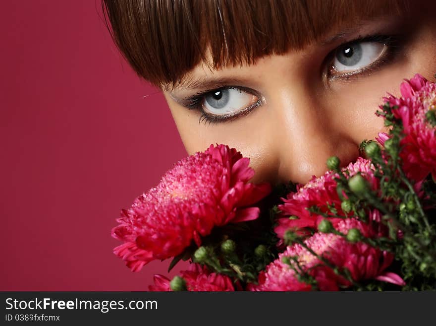 Portrait of a young woman with pink flowers. Portrait of a young woman with pink flowers