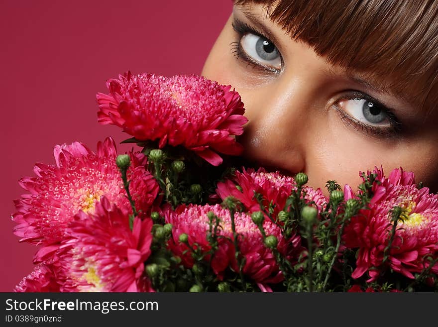 Portrait of a young woman with pink flowers. Portrait of a young woman with pink flowers