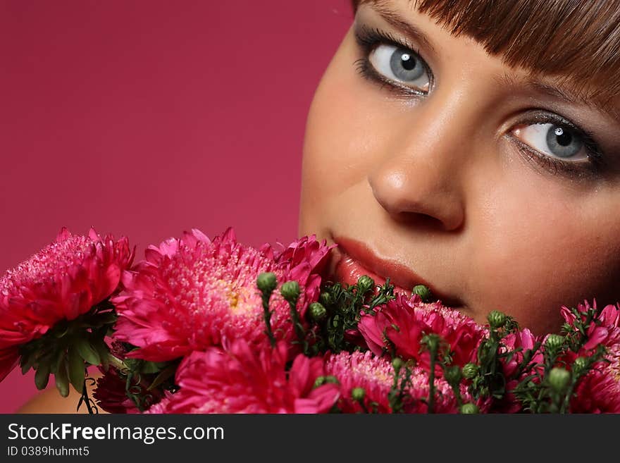 Portrait of a young woman with pink flowers. Portrait of a young woman with pink flowers