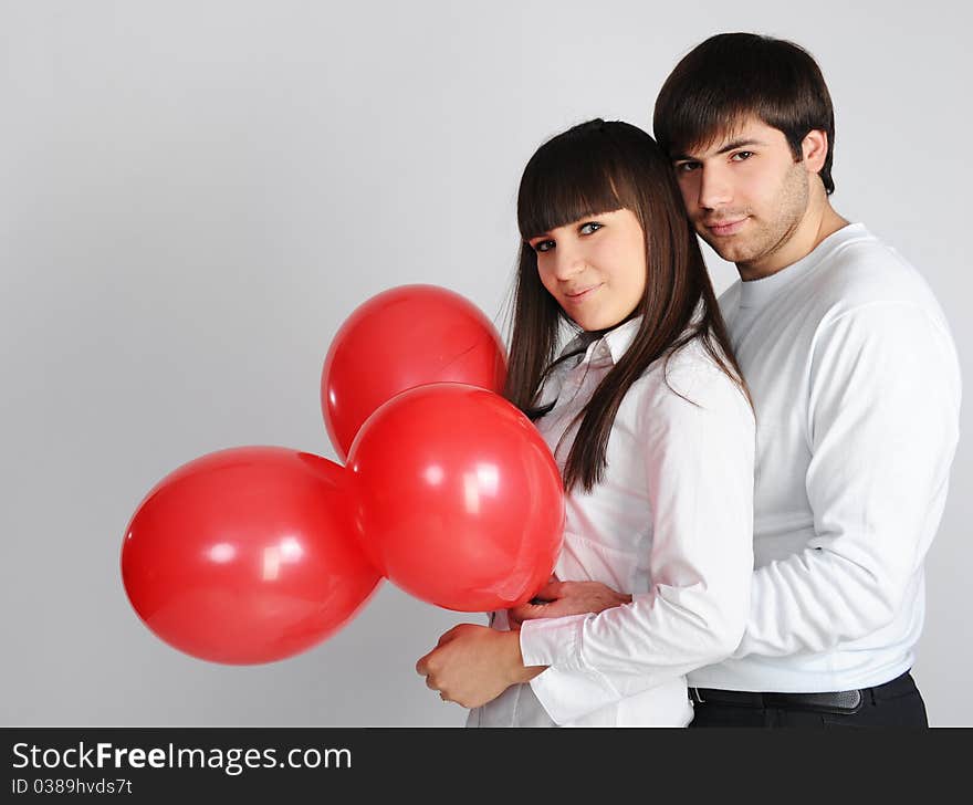 Love couple with red balloons, isolated on white. Love couple with red balloons, isolated on white