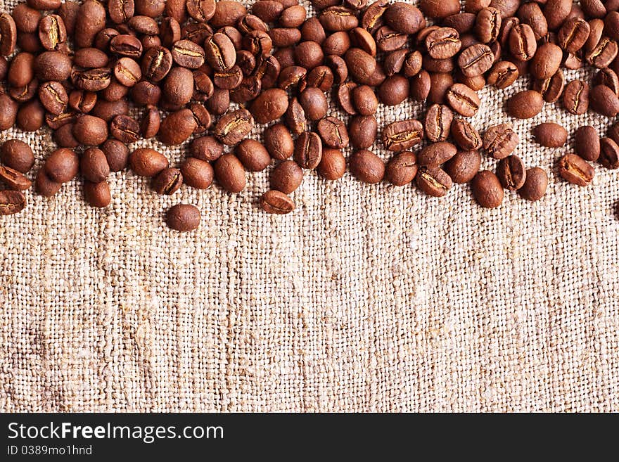 Grains of coffee on a fabric. Horizontal