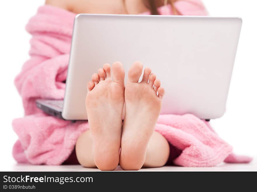 Girl in pink sitting with laptop