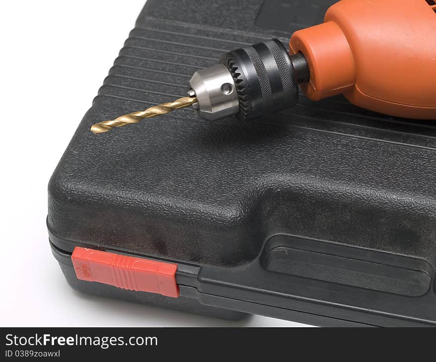 An electric drill on the case in close-up