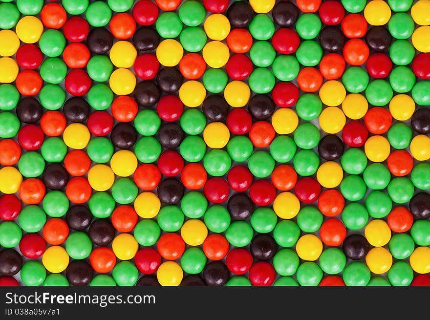 Background of colorful candies coated chocolate sweets