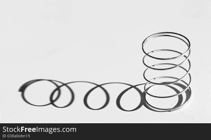 Photo of a Helical spring with shadow...