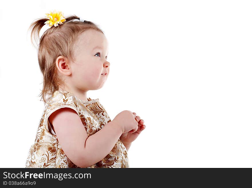 Little beautiful girl looks up isolated on white