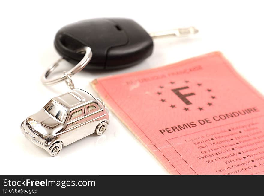 Key car with little key ring in car's shape isolated on white background