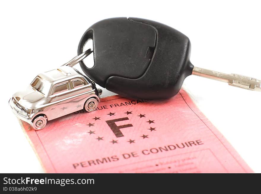 Key car with little key ring in car's shape isolated on white background