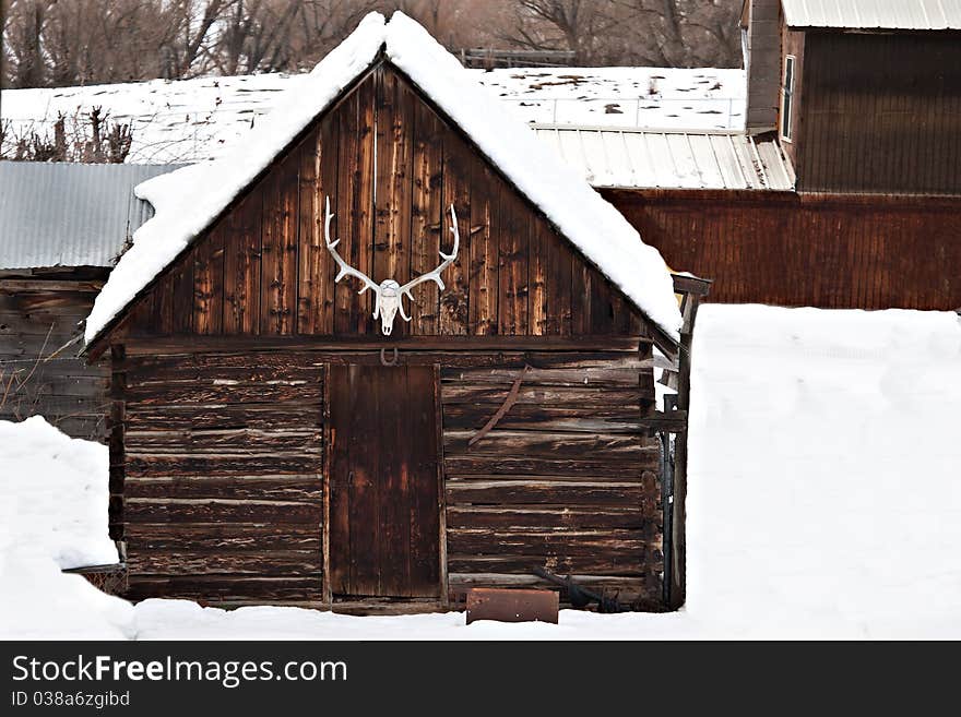 Old Barn With Elk Antlers In Winter