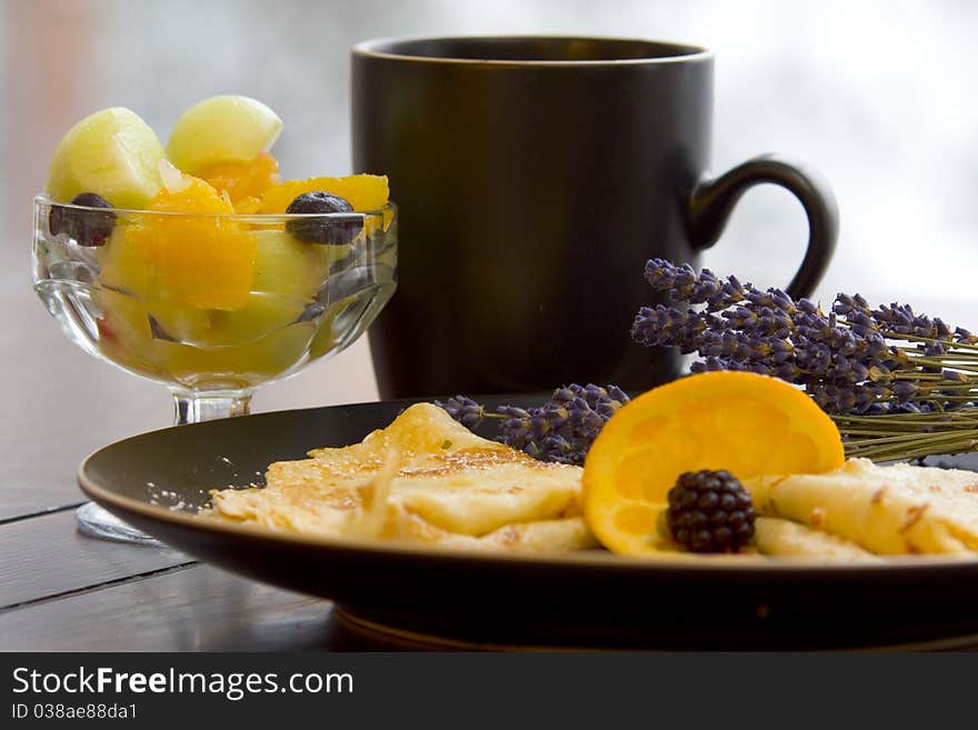 Beautiful fresh crepes and fruit over coffee. Beautiful fresh crepes and fruit over coffee